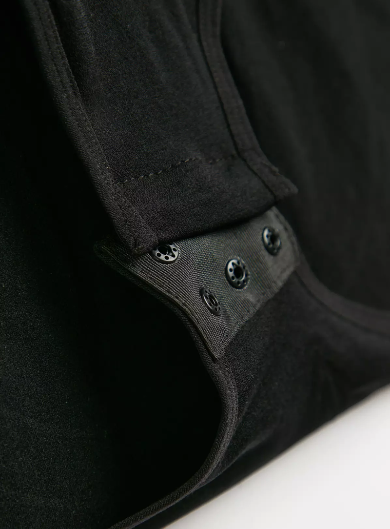 Close-up of shapewear bodysuit showing adjustable strap detail